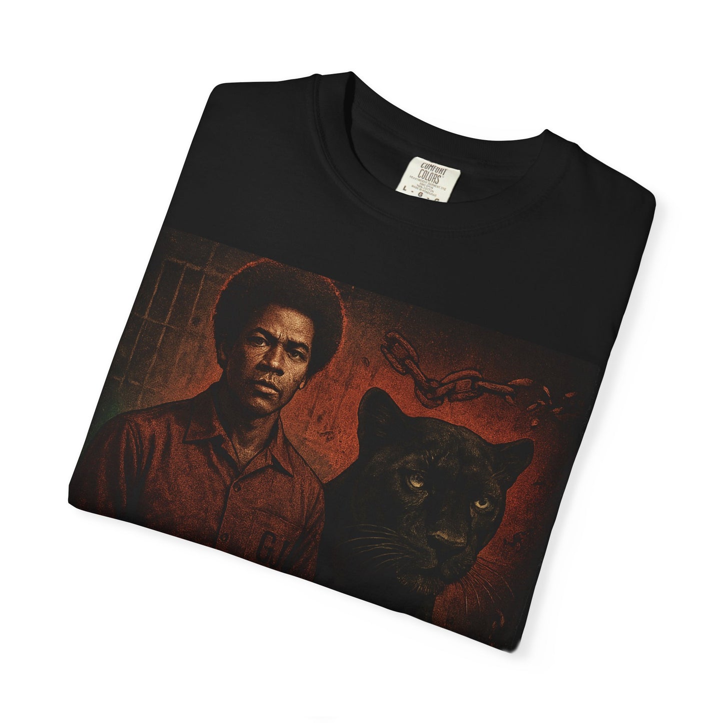 Folded black George Jackson Revolutionary T-Shirt with striking red-toned artwork and bold political message. Soft 100% cotton fabric.