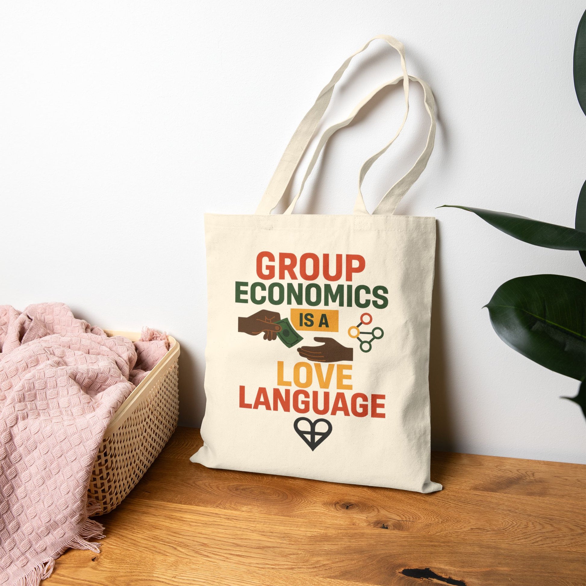 Durable and stylish Love Language Tote Bag resting on a wooden surface, made from eco-friendly cotton canvas with a bold social justice message.