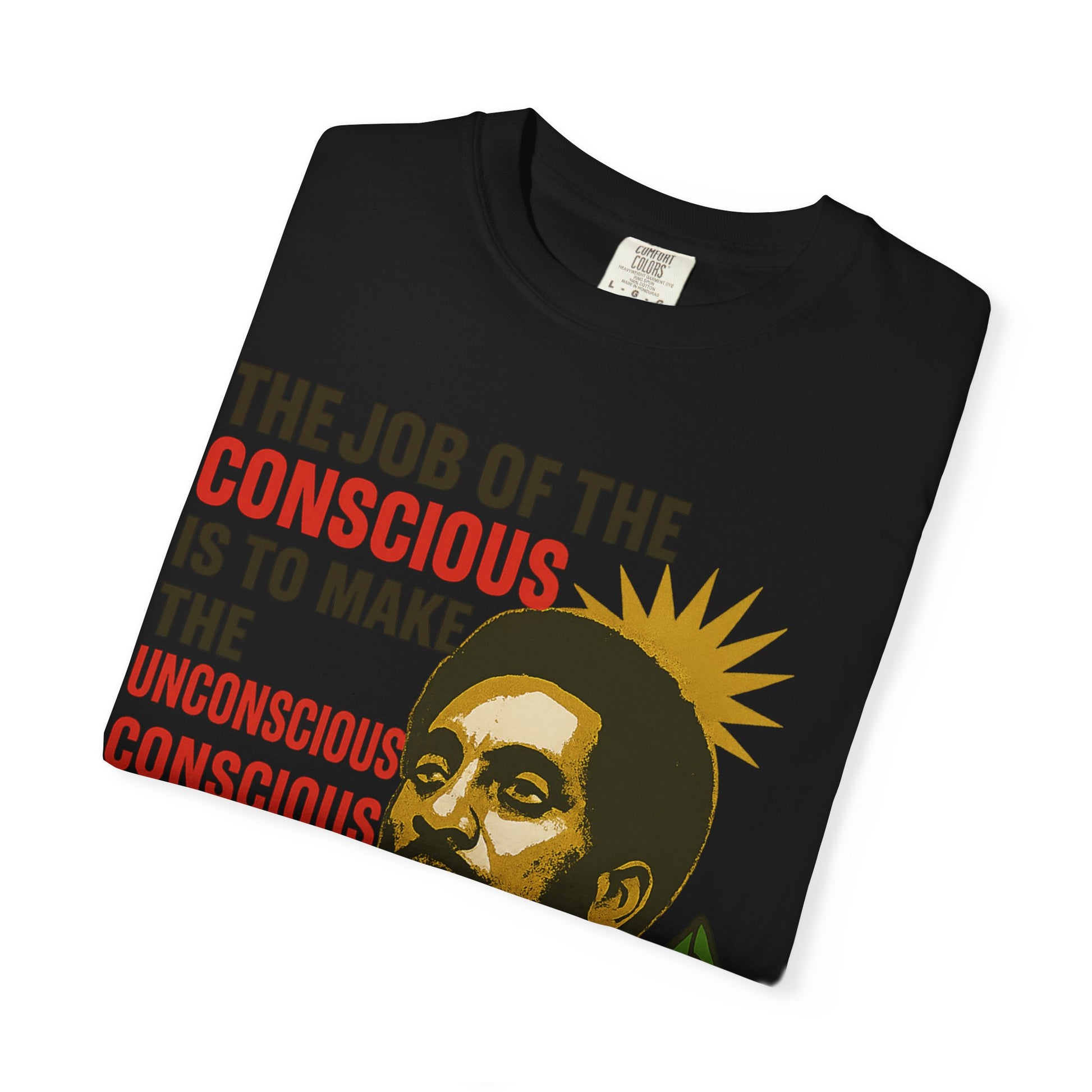 Folded black Kwame Ture Tee with colorful activist artwork and quote, made from soft garment-dyed cotton for comfort.